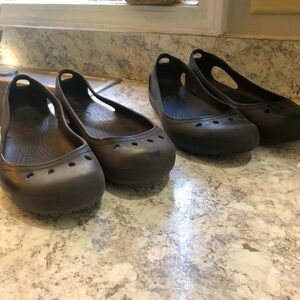 Black pair and brown pair. Size 10. Crocs. Worn a few times. Great condition